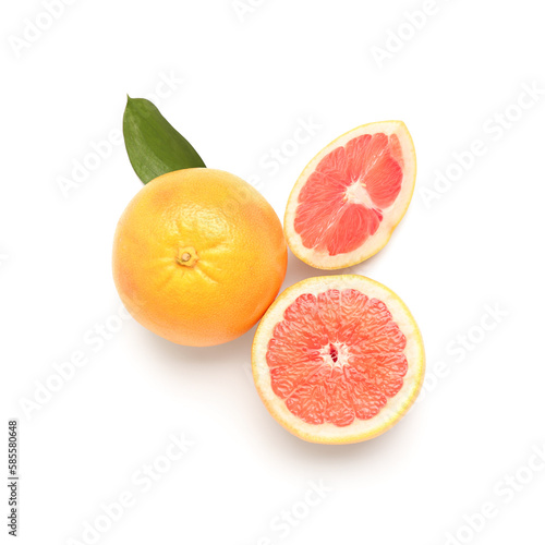 Composition with whole and cut grapefruits isolated on white background