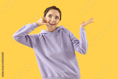 Young woman showing "call m...