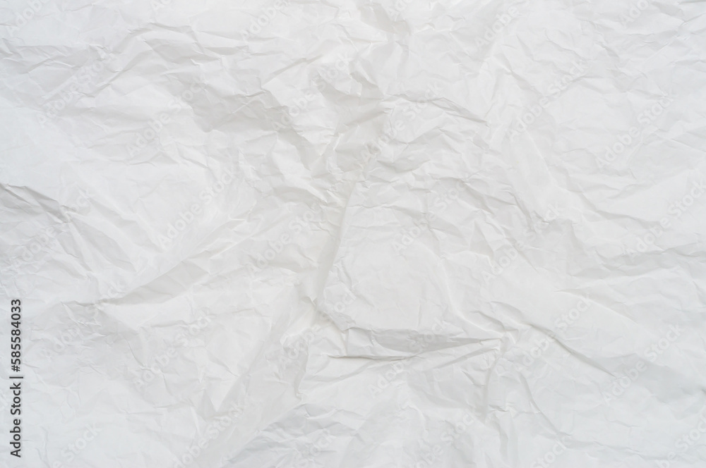 Wrinkled or crumpled white stencil paper or tissue after use in toilet or restroom with large copy space used for background texture in art work