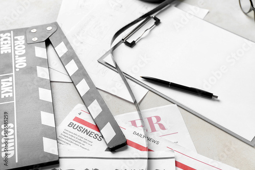 Clipboard with film, newspa...