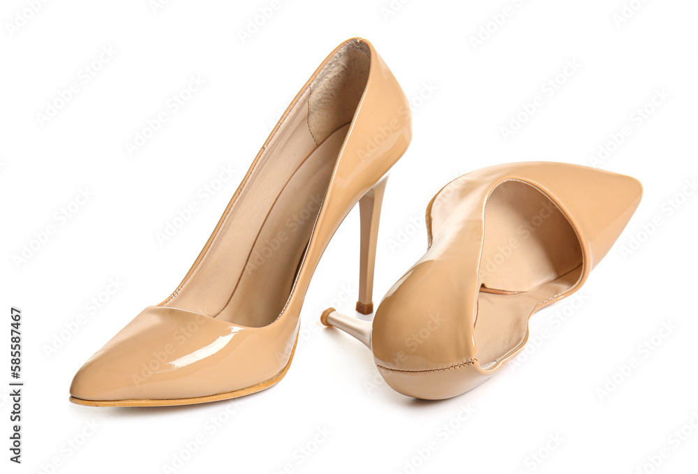 Pair of beige high heeled shoes on white background Pair of beige high heeled shoes on white background