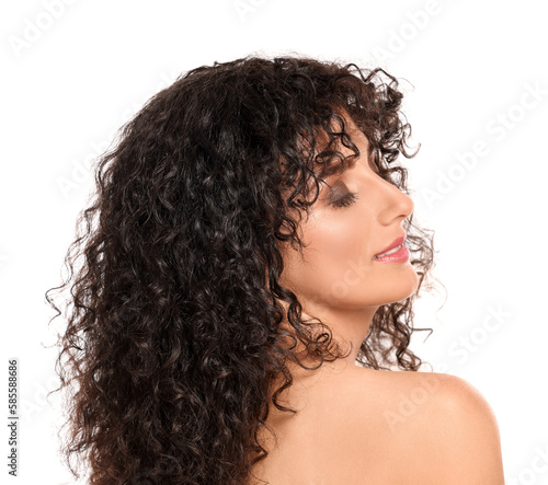 Beautiful young woman with long curly hair on white background