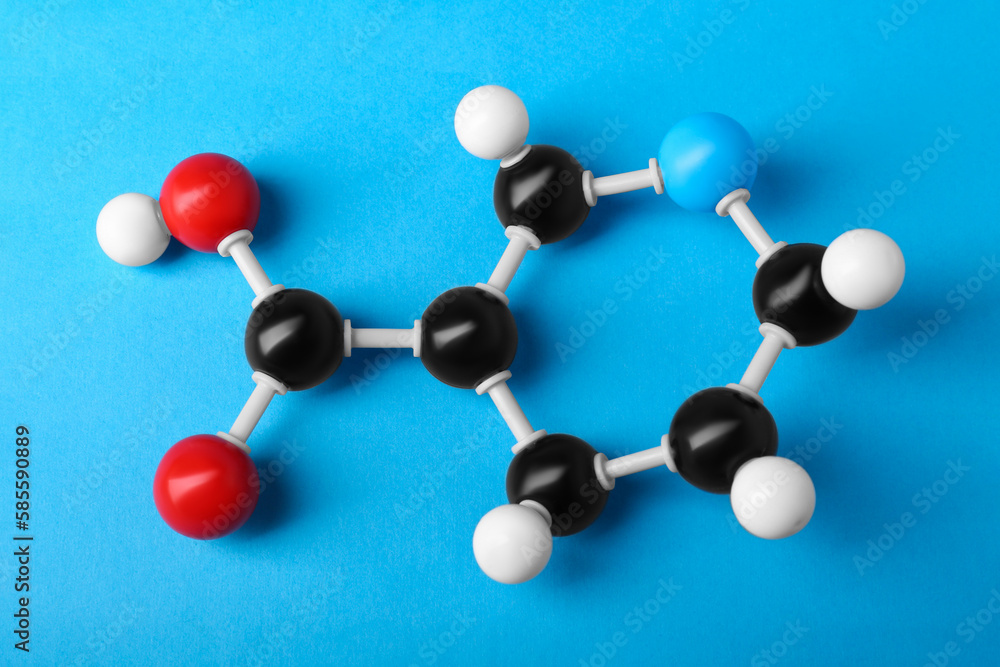 Obraz premium Molecule of vitamin B3 on light blue background, above view. Chemical model