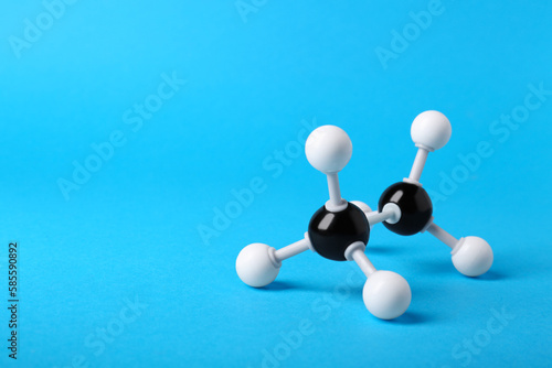 Molecule of alcohol on light blue background  space for text. Chemical model