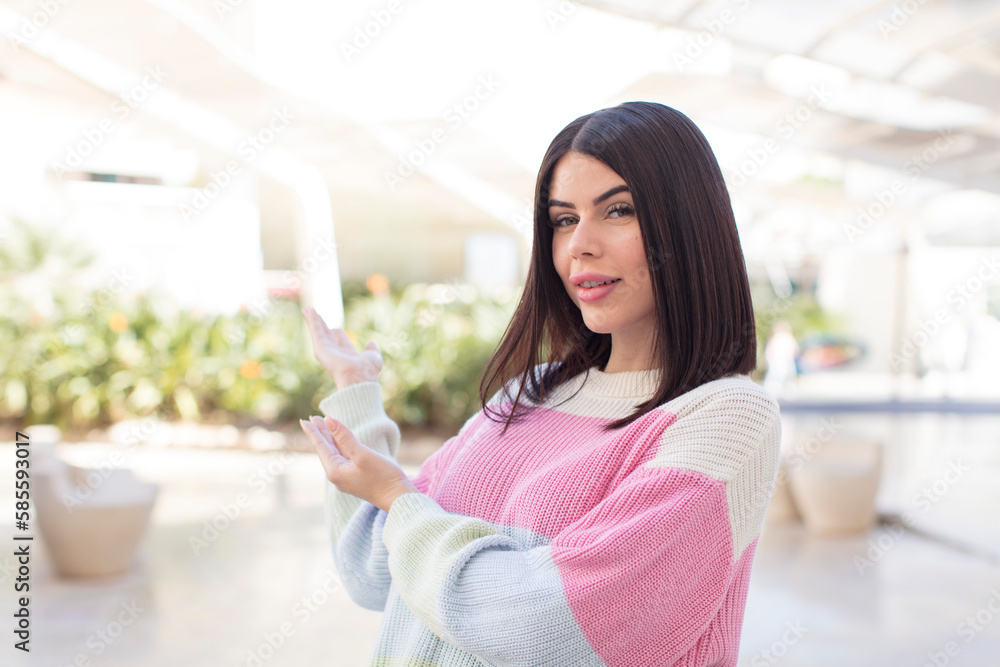 young pretty woman feeling happy and cheerful, smiling and welcoming you, inviting you in with a friendly gesture young pretty woman feeling happy and cheerful, smiling and welcoming you, inviting you in with a friendly gesture