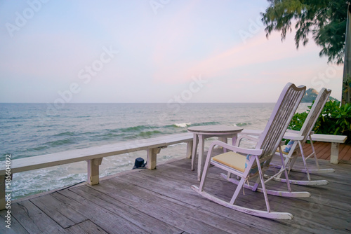 empty chair on balcony with sea background