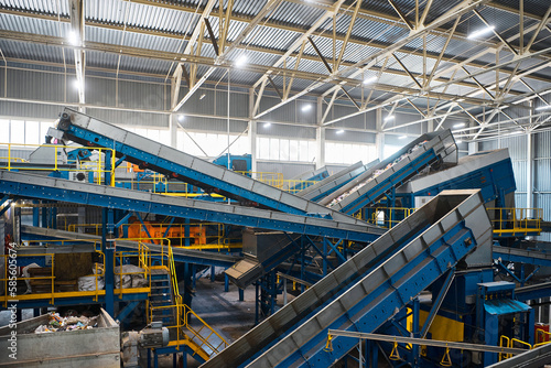 Fotografie System of conveyors carrying trash at waste processing plant