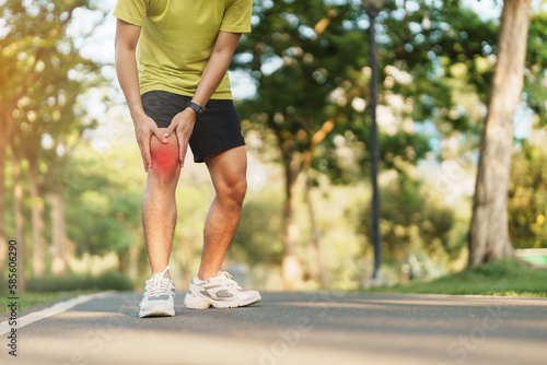 Young adult male with muscle pain during running. runner have knee ache due to Runners Knee or Patellofemoral Pain Syndrome, osteoarthritis and Patellar Tendinitis. Sports injuries and medical concept