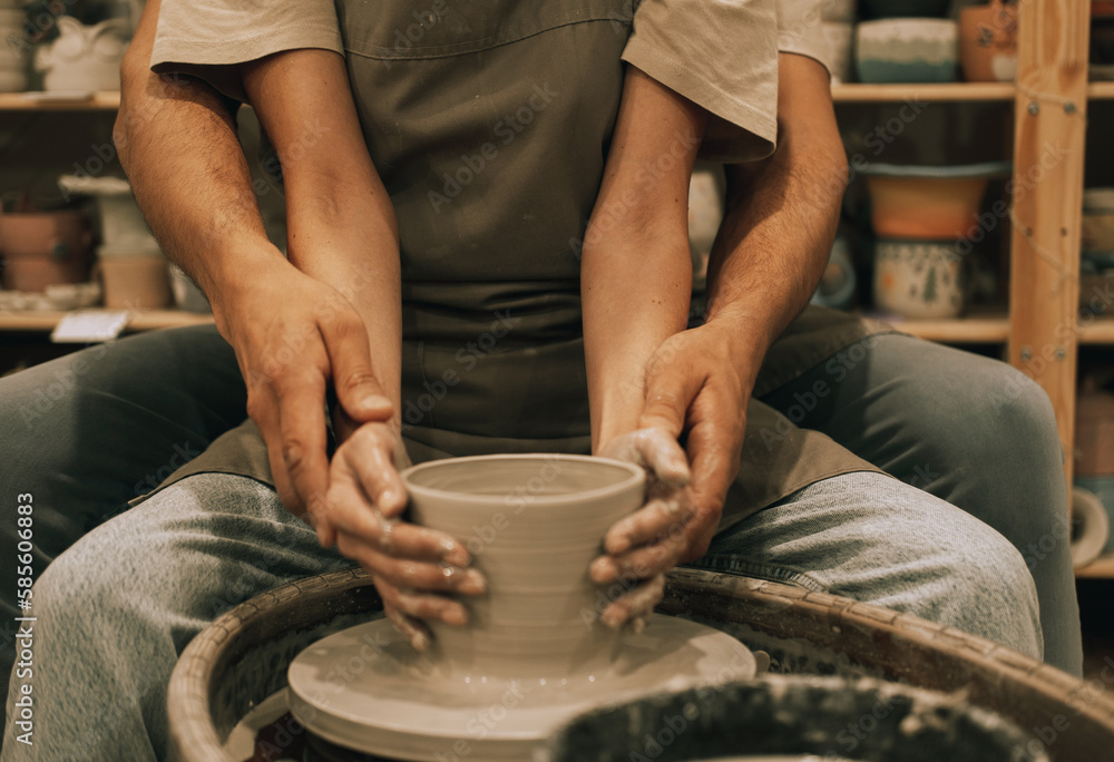 Couple mold ceramic vase in a pottery workshop, hands close up. Couple mold ceramic vase in a pottery workshop, hands close up.