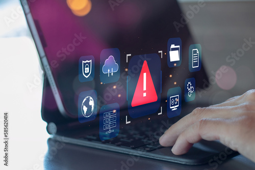 Developer programmer using laptop with warning triangle sign for alert found error and maintenance concept