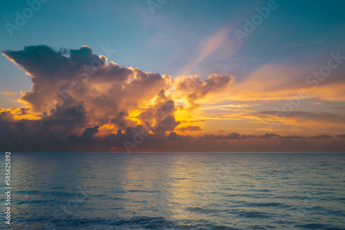 Sunrise sea on tropical beach background. Landscape of beautiful beach. Beautiful sunset at sea. Ocean sunset on sky background with colorful clouds. Vacation travel holiday banner.