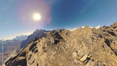 360 VR Gokyo Ri mountain top. Tibetan prayer Buddhist flag. Wild Himalayas high altitude nature and mount valley. Rocky slopes covered with snow. Tiny planet transformation.