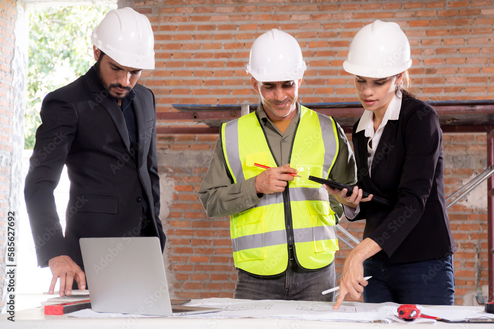 Team architect or engineer man and woman meeting for planning and strategy of development real estate at construction site, contractor and partner talking and looking blueprint, industrial concept. Team architect or engineer man and woman meeting for planning and strategy of development real estate at construction site, contractor and partner talking and looking blueprint, industrial concept.