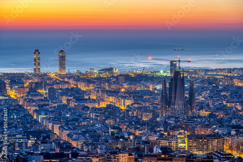 The skyline of Barcelona with the famous Sagrada Familia before sunrise