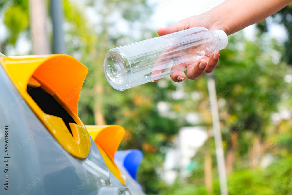 Please throw plastic bottles in the bin. Man littering the bins by