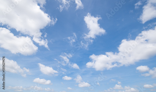 Panoramic view of clear blue sky and clouds  Blue sky background with tiny clouds. White fluffy clouds in the blue sky.