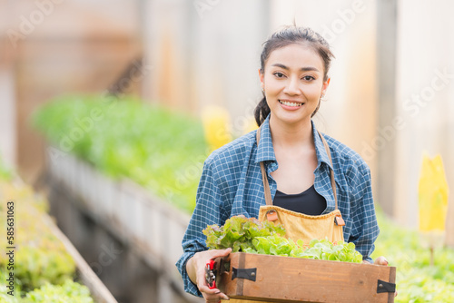 Farmer woman holding wooden...
