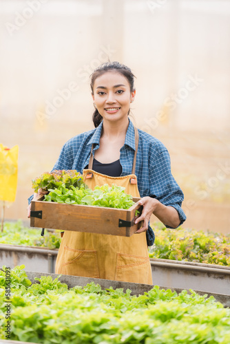 Farmer woman holding wooden...