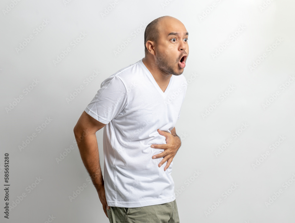 Man had a stomach ache and gastritis. He put hand on his stomach and squeezed it to relax and soothe has go to toilet need to poop Man had a stomach ache and gastritis. He put hand on his stomach and squeezed it to relax and soothe has go to toilet need to poop