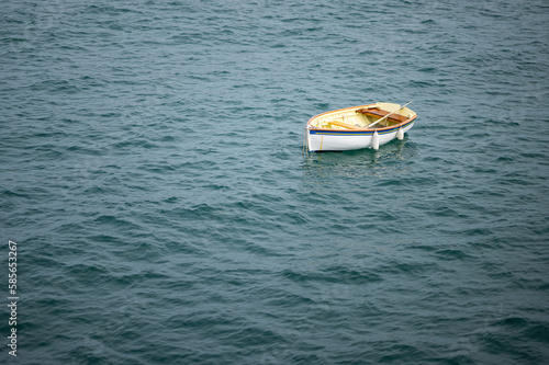 A small boat floating in the sea