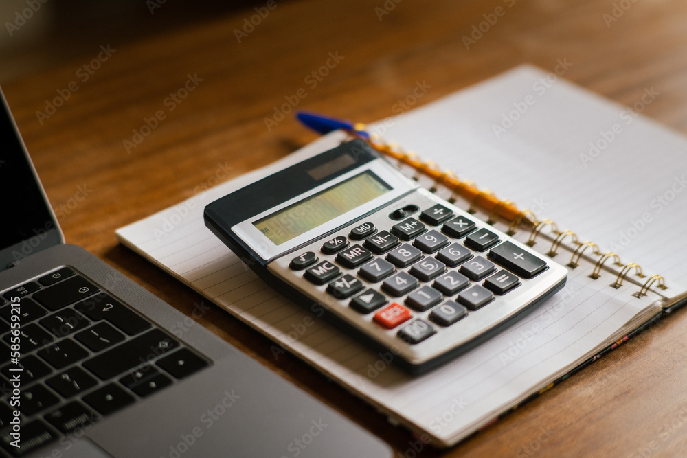 counting bills, accountant table with glasses, calculator and notebook with pencil counting bills, accountant table with glasses, calculator and notebook with pencil