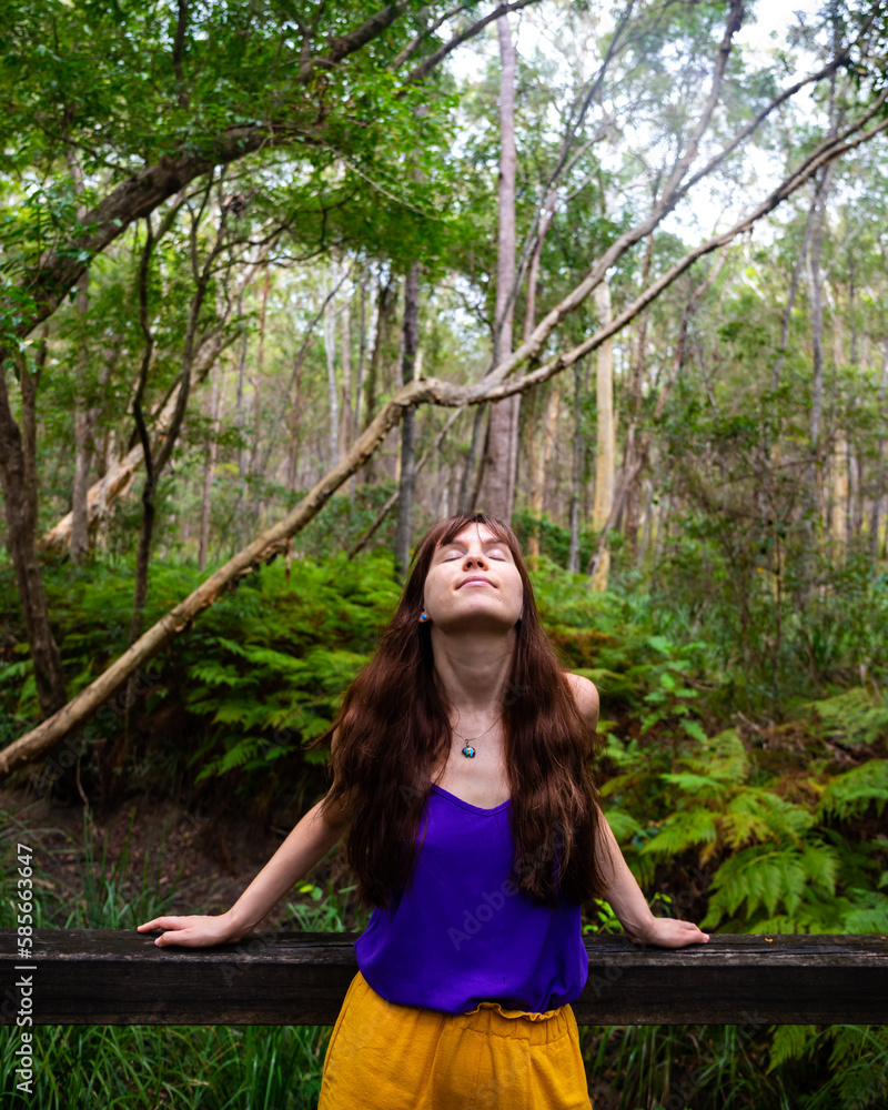 Beautiful girl in colorful clothes andmires and walks in Brisbane Koala Bushlands Park, Queensland, Australia Beautiful girl in colorful clothes andmires and walks in Brisbane Koala Bushlands Park, Queensland, Australia