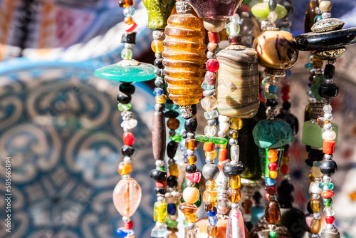 Close-up of decorative pendant made of colored stones for sale in the souk of the Medina in Marrakesh, Morocco © Alessandro Vecchi
