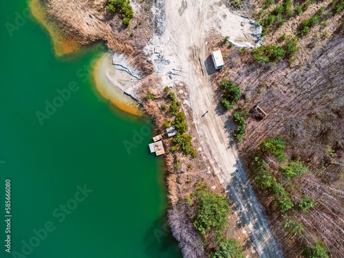 Obraz na płótnie Aerial view landscape. Green water, factory, mining, sand. Photo from a drone. w salonie