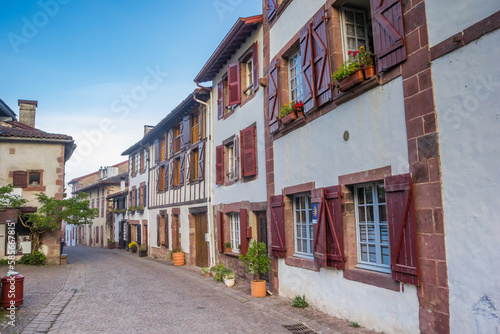 Old houses with shutters in the historic central street of Saint-Jean-Pied-de-Port, France © venemama