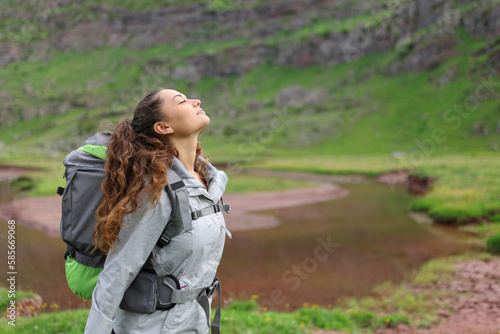 Hiker breathing in a riverside