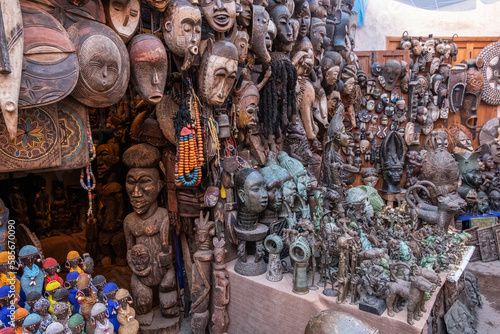 Tribal masks for sale in a market in a souk in the Medina around the Jemaa el-Fnaa square in Marrakesh Morocco
