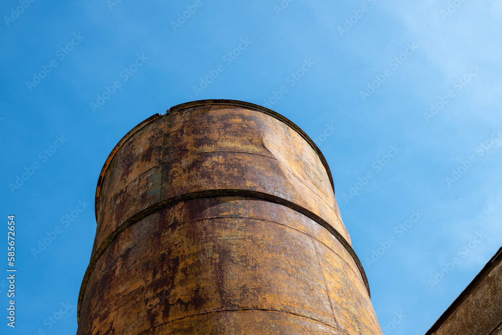 old chimney against blue sky