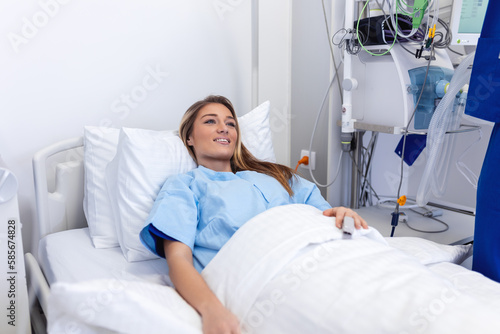 Young woman laying on bed at hospital ward. medicine  health care and quarantine concept. female patient lying in bed in hospital ward