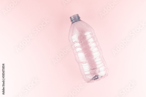 Plastic water bottle on pink background