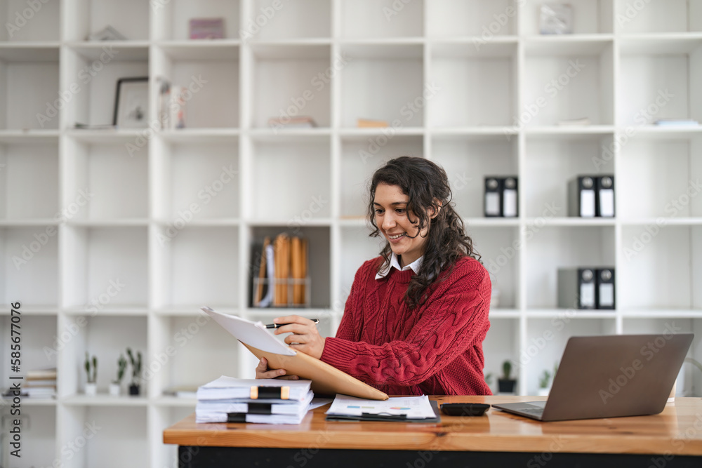 Businesswoman read data on document to analysis marketing plan. Online remotely or webinar Businesswoman read data on document to analysis marketing plan. Online remotely or webinar