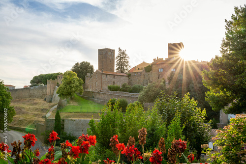 Italy, Lazio, Tuscania, Sun setting behind Torre di Lavello