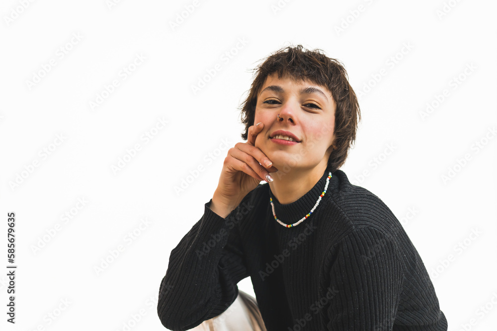 Girl with short dark haired hairs and bang smiling for photo model shoot slightly smiling and with hand on her face. High quality photo Girl with short dark haired hairs and bang smiling for photo model shoot slightly smiling and with hand on her face. High quality photo