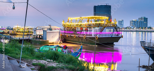 Floating nightclubs and pleasure boats,illuminated after sunset,Phnom Penh,Cambodia.