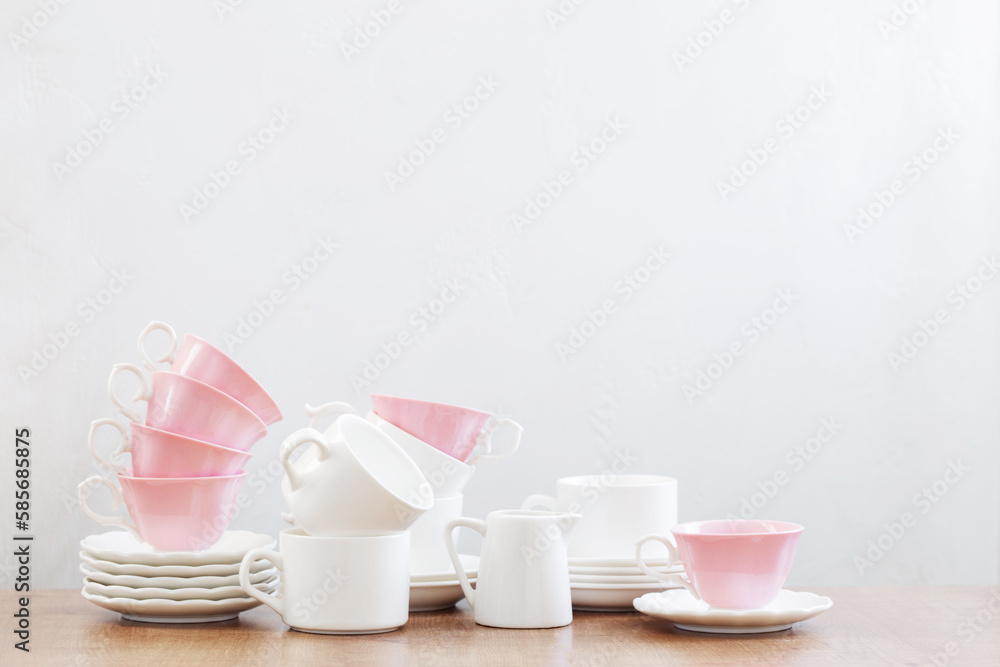 group of different cups on wooden table on white background group of different cups on wooden table on white background