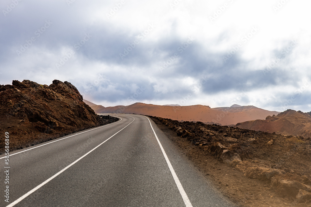 Long road through the lava fields of Lanzarote Long road through the lava fields of Lanzarote