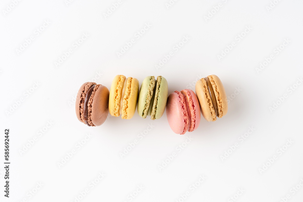 Sweet macaroons on white background with copyspace. Flat lay Sweet macaroons on white background with copyspace. Flat lay