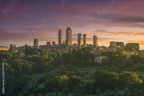 The medieval towers of the village of San Gimignano at sunset. Tuscany, Italy