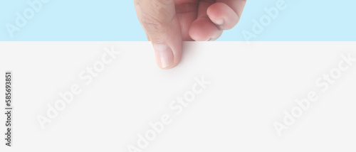 Hands holding paper blank for  letter paper