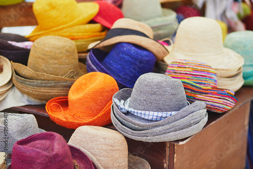 Straw hats on street market in Cucuron, Provence, France