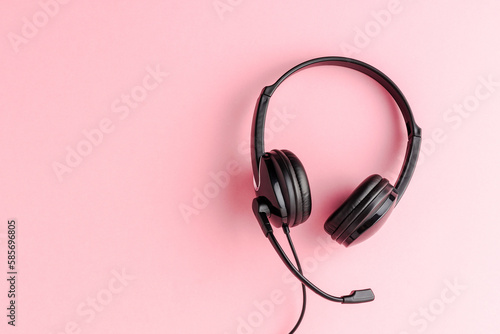 Overheadshot of headset on background with copyspace. Call center concept