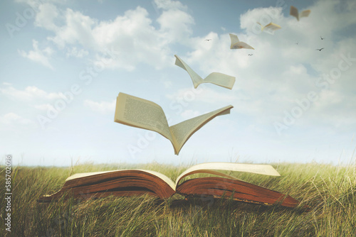 surreal pages of an open book fly free like birds in the sky