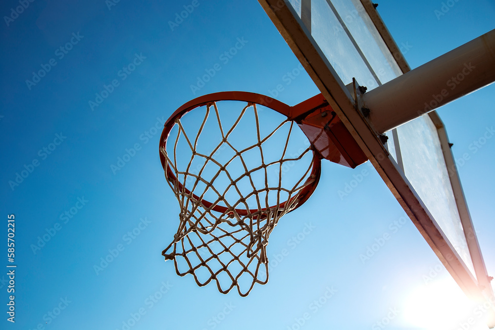 basketball hoop on blue sky background outdoors, copy space, sport school 
