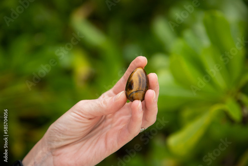 woman holding yoni egg self care tantra