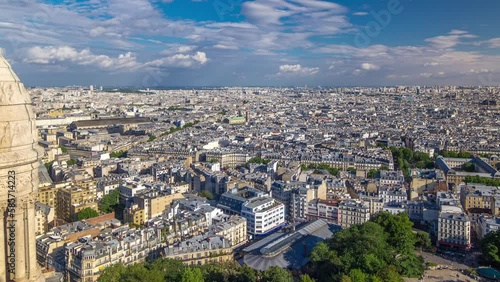 Wallpaper Mural Panorama of Paris from above timelapse, France. Aerial top view from Montmartre viewpoint. Sunny day with blue cloudy sky over historic buildings Torontodigital.ca
