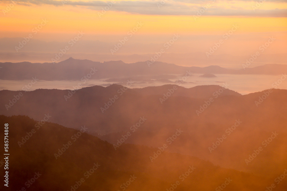 Beautiful Landscape In The Mountains At Sunrise.Foggy Mountain Landscape Warm Tone Photo Beautiful Landscape In The Mountains At Sunrise.Foggy Mountain Landscape Warm Tone Photo